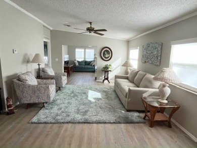 Welcome your guests to a private and serene space, situated on on Del Tura Golf and Country Club in Florida - for sale on GolfHomes.com, golf home, golf lot
