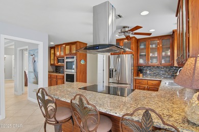 Stately Bay Point pool home with screened lanai on quiet on Bay Point Resort Golf Club in Florida - for sale on GolfHomes.com, golf home, golf lot