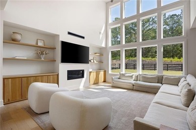 Welcome home to this executive home built by the Toll Brothers on Capital City Club Crabapple in Georgia - for sale on GolfHomes.com, golf home, golf lot