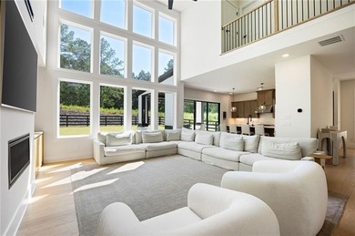 Welcome home to this executive home built by the Toll Brothers on Capital City Club Crabapple in Georgia - for sale on GolfHomes.com, golf home, golf lot