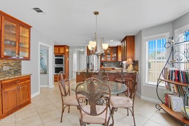 Stately Bay Point pool home with screened lanai on quiet on Bay Point Resort Golf Club in Florida - for sale on GolfHomes.com, golf home, golf lot