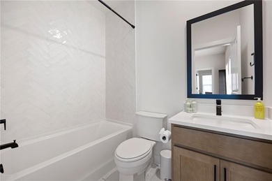 Welcome home to this executive home built by the Toll Brothers on Capital City Club Crabapple in Georgia - for sale on GolfHomes.com, golf home, golf lot