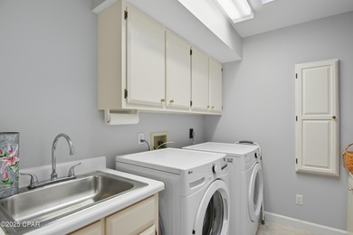 Stately Bay Point pool home with screened lanai on quiet on Bay Point Resort Golf Club in Florida - for sale on GolfHomes.com, golf home, golf lot