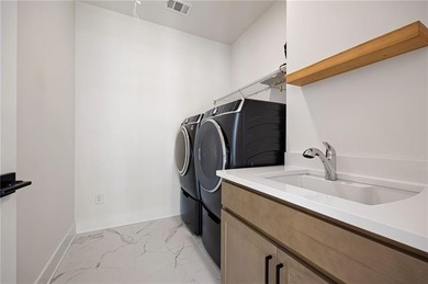 Welcome home to this executive home built by the Toll Brothers on Capital City Club Crabapple in Georgia - for sale on GolfHomes.com, golf home, golf lot