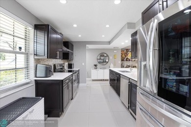 LOOK AT THIS GEM NESTLED IN PALM AIRE COUNTRY CLUB!! ALL AGES on Palm-Aire Country Club and Resort - The Oaks in Florida - for sale on GolfHomes.com, golf home, golf lot