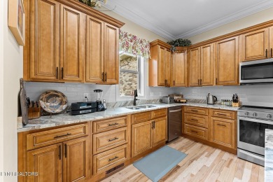 All-brick home with many upgrades is located within the Tellico on Tellico Village -The Links At Kahite Golf Course in Tennessee - for sale on GolfHomes.com, golf home, golf lot