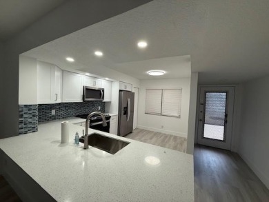 PRICE REDUCED! Very desirable unit!!Completely remodeled! 1st on Flamingo Lakes Country Club in Florida - for sale on GolfHomes.com, golf home, golf lot