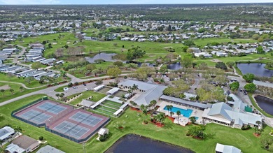 Welcome Home to this charming LAND OWNED 2/2 with a 2020 roof on Spanish Lakes Golf Village in Florida - for sale on GolfHomes.com, golf home, golf lot