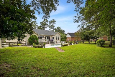 Welcome to your dream home in the heart of Wedgefield Plantation on Wedgefield Plantation Golf Club in South Carolina - for sale on GolfHomes.com, golf home, golf lot