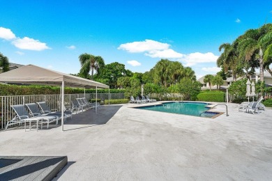 With a spectacular picture-perfect view of the lake and golf on Polo Club of Boca Raton in Florida - for sale on GolfHomes.com, golf home, golf lot