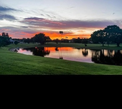 Enjoy panoramic lake and golf course views from this well on Heritage Ridge Golf Club in Florida - for sale on GolfHomes.com, golf home, golf lot