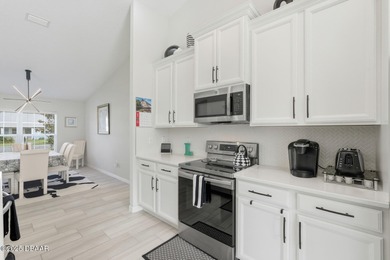 Immaculate Seagate-built Willow model located in the desirable on The Grand Club - Pine Lakes Course in Florida - for sale on GolfHomes.com, golf home, golf lot