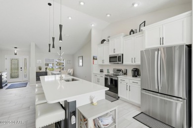 Immaculate Seagate-built Willow model located in the desirable on The Grand Club - Pine Lakes Course in Florida - for sale on GolfHomes.com, golf home, golf lot