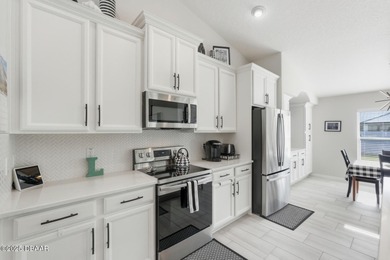 Immaculate Seagate-built Willow model located in the desirable on The Grand Club - Pine Lakes Course in Florida - for sale on GolfHomes.com, golf home, golf lot