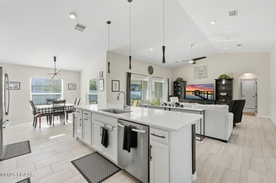 Immaculate Seagate-built Willow model located in the desirable on The Grand Club - Pine Lakes Course in Florida - for sale on GolfHomes.com, golf home, golf lot