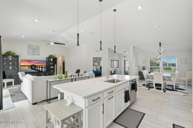 Immaculate Seagate-built Willow model located in the desirable on The Grand Club - Pine Lakes Course in Florida - for sale on GolfHomes.com, golf home, golf lot