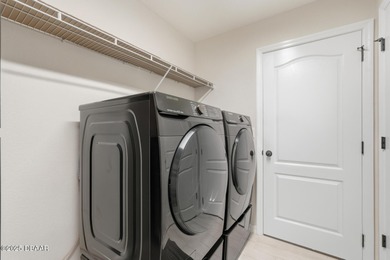 Immaculate Seagate-built Willow model located in the desirable on The Grand Club - Pine Lakes Course in Florida - for sale on GolfHomes.com, golf home, golf lot