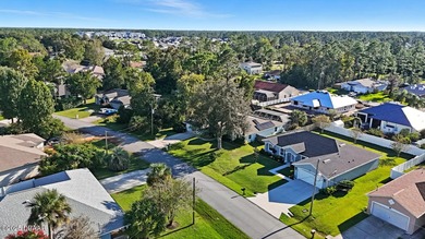Immaculate Seagate-built Willow model located in the desirable on The Grand Club - Pine Lakes Course in Florida - for sale on GolfHomes.com, golf home, golf lot
