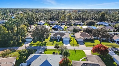 Immaculate Seagate-built Willow model located in the desirable on The Grand Club - Pine Lakes Course in Florida - for sale on GolfHomes.com, golf home, golf lot