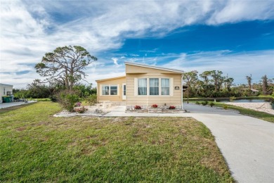 GREAT PRICE on this updated doublewide lakefront FULLY FURNISHED on Lemon Bay Golf Club in Florida - for sale on GolfHomes.com, golf home, golf lot