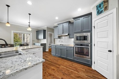 Situated on a corner lot, this home welcomes you with a concrete on The Neuse Golf Club in North Carolina - for sale on GolfHomes.com, golf home, golf lot