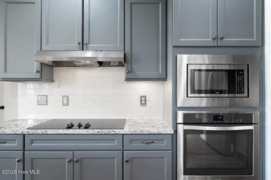 Situated on a corner lot, this home welcomes you with a concrete on The Neuse Golf Club in North Carolina - for sale on GolfHomes.com, golf home, golf lot