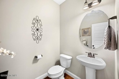 Situated on a corner lot, this home welcomes you with a concrete on The Neuse Golf Club in North Carolina - for sale on GolfHomes.com, golf home, golf lot