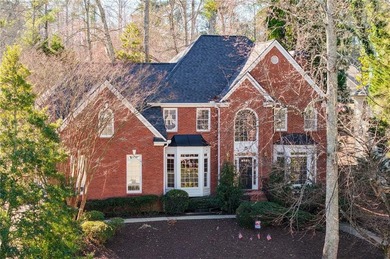 Tucked away on a quiet, double cul-de-sac street is the stately on Brookstone Golf and Country Club in Georgia - for sale on GolfHomes.com, golf home, golf lot