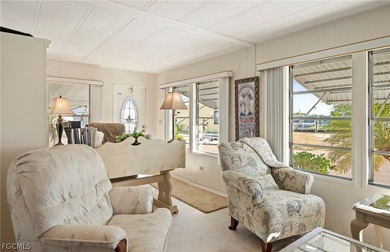 Fully furnished manufactured home in a 55+ waterfront gulf on Riverbend Golf and Country Club in Florida - for sale on GolfHomes.com, golf home, golf lot