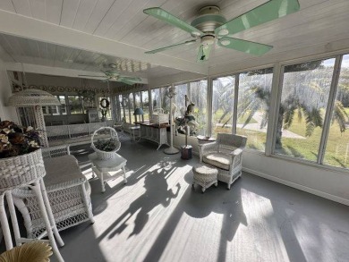 This charming home is perfectly located near the clubhouse and on Four Lakes Golf Club in Florida - for sale on GolfHomes.com, golf home, golf lot