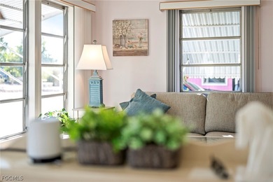 Fully furnished manufactured home in a 55+ waterfront gulf on Riverbend Golf and Country Club in Florida - for sale on GolfHomes.com, golf home, golf lot