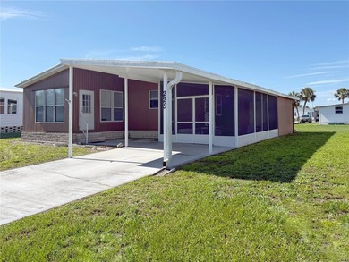 This very affordable two bedroom, two bathroom home is located on Apollo Beach Golf and Sea Club in Florida - for sale on GolfHomes.com, golf home, golf lot