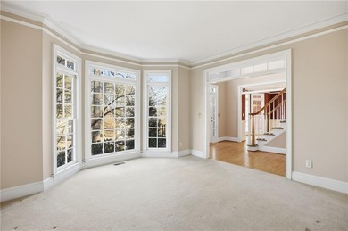 Tucked away on a quiet, double cul-de-sac street is the stately on Brookstone Golf and Country Club in Georgia - for sale on GolfHomes.com, golf home, golf lot