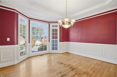 Tucked away on a quiet, double cul-de-sac street is the stately on Brookstone Golf and Country Club in Georgia - for sale on GolfHomes.com, golf home, golf lot