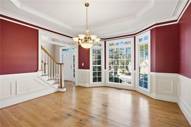 Tucked away on a quiet, double cul-de-sac street is the stately on Brookstone Golf and Country Club in Georgia - for sale on GolfHomes.com, golf home, golf lot