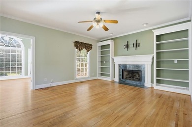 Tucked away on a quiet, double cul-de-sac street is the stately on Brookstone Golf and Country Club in Georgia - for sale on GolfHomes.com, golf home, golf lot