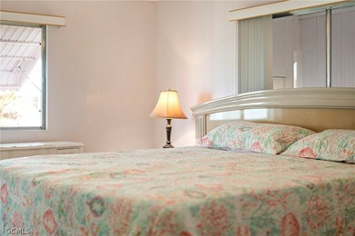 Fully furnished manufactured home in a 55+ waterfront gulf on Riverbend Golf and Country Club in Florida - for sale on GolfHomes.com, golf home, golf lot