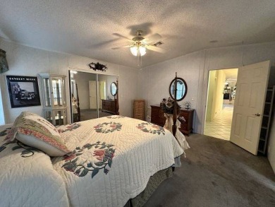 This charming home is perfectly located near the clubhouse and on Four Lakes Golf Club in Florida - for sale on GolfHomes.com, golf home, golf lot