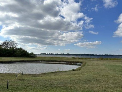 This charming home is perfectly located near the clubhouse and on Four Lakes Golf Club in Florida - for sale on GolfHomes.com, golf home, golf lot