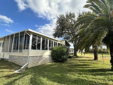 This charming home is perfectly located near the clubhouse and on Four Lakes Golf Club in Florida - for sale on GolfHomes.com, golf home, golf lot