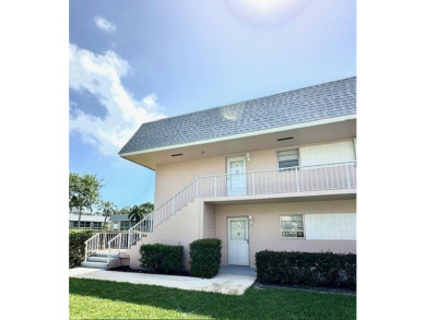 Come see this beautiful first floor end unit in charming on The Little Club in Florida - for sale on GolfHomes.com, golf home, golf lot