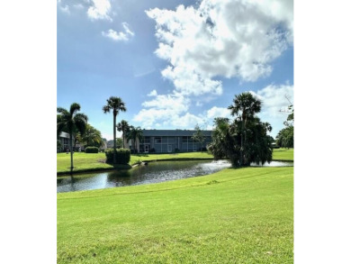 Come see this beautiful first floor end unit in charming on The Little Club in Florida - for sale on GolfHomes.com, golf home, golf lot