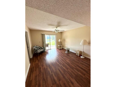 Come see this beautiful first floor end unit in charming on The Little Club in Florida - for sale on GolfHomes.com, golf home, golf lot