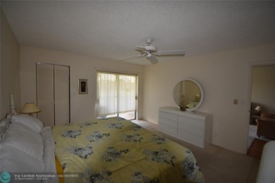 Discover convenience, and scenic beauty in this lovely 2-bedroom on Inverrary Country Club in Florida - for sale on GolfHomes.com, golf home, golf lot