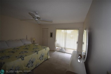 Discover convenience, and scenic beauty in this lovely 2-bedroom on Inverrary Country Club in Florida - for sale on GolfHomes.com, golf home, golf lot