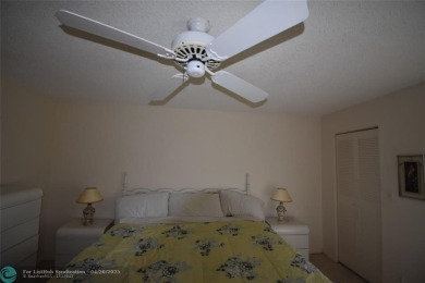Discover convenience, and scenic beauty in this lovely 2-bedroom on Inverrary Country Club in Florida - for sale on GolfHomes.com, golf home, golf lot
