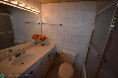 Discover convenience, and scenic beauty in this lovely 2-bedroom on Inverrary Country Club in Florida - for sale on GolfHomes.com, golf home, golf lot