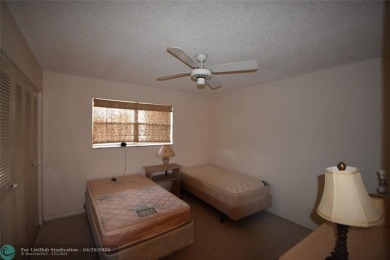 Discover convenience, and scenic beauty in this lovely 2-bedroom on Inverrary Country Club in Florida - for sale on GolfHomes.com, golf home, golf lot