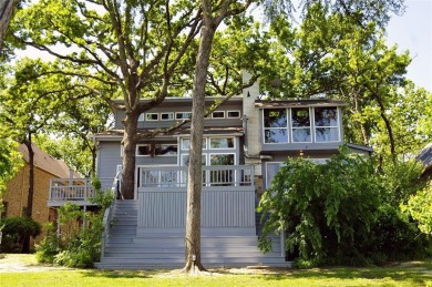 This unique lake home features large windows, offering on Lake Kiowa Golf Course in Texas - for sale on GolfHomes.com, golf home, golf lot