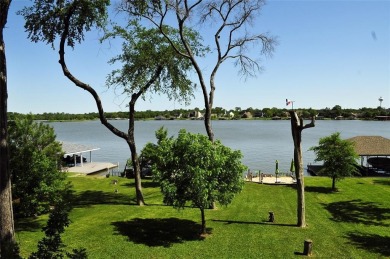 This unique lake home features large windows, offering on Lake Kiowa Golf Course in Texas - for sale on GolfHomes.com, golf home, golf lot